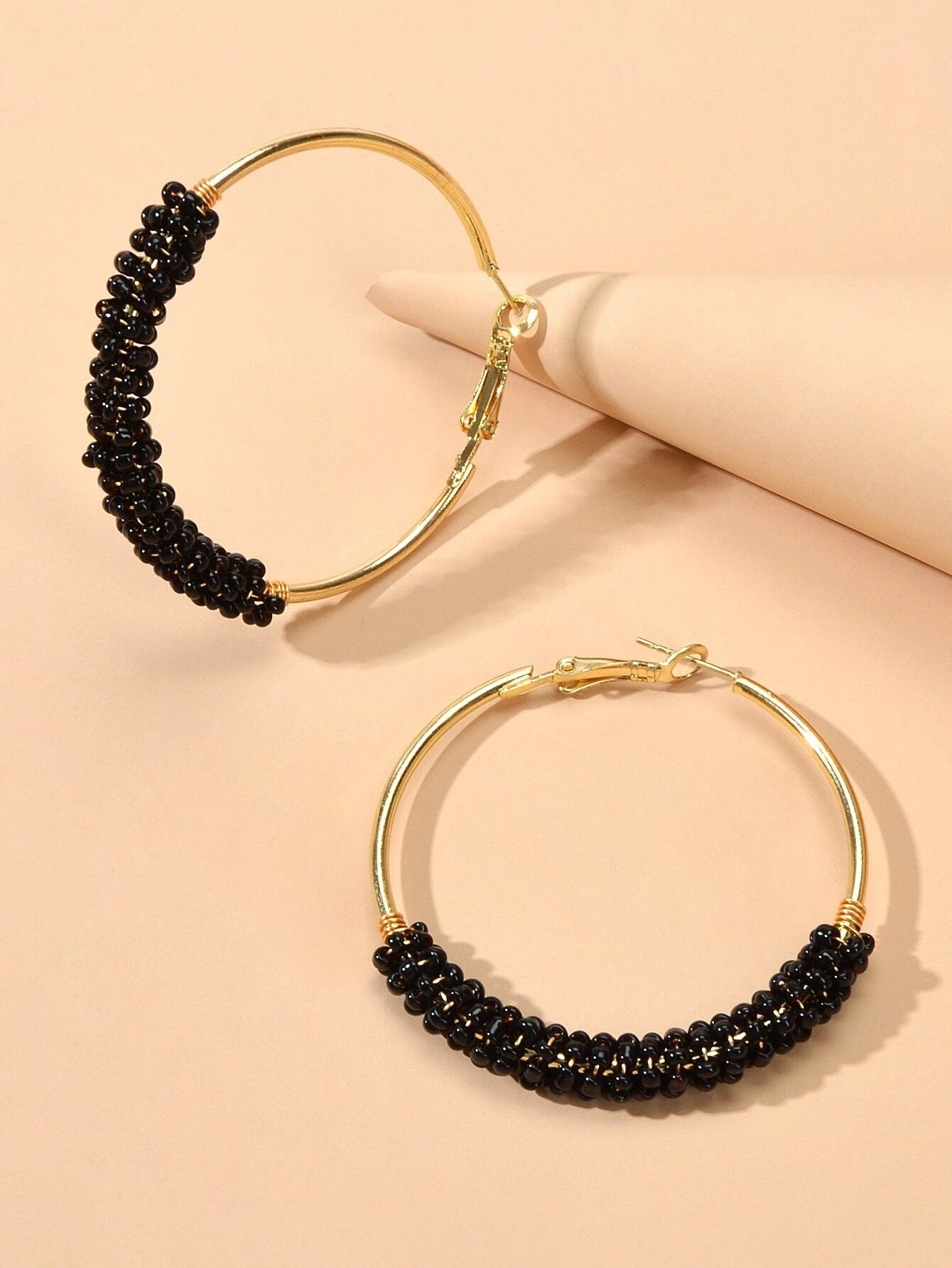 Black beaded on sale hoop earrings